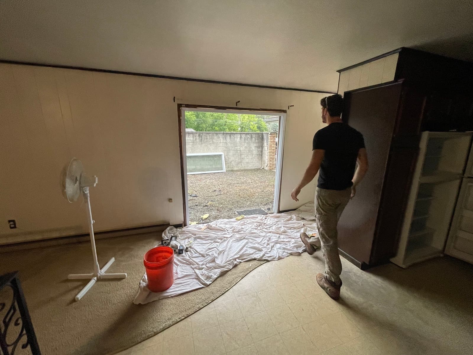 Room cleared out, opening to the backyard